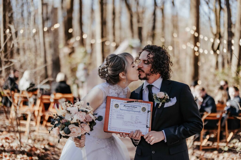 Couple posing with their newly signed marriage license! 