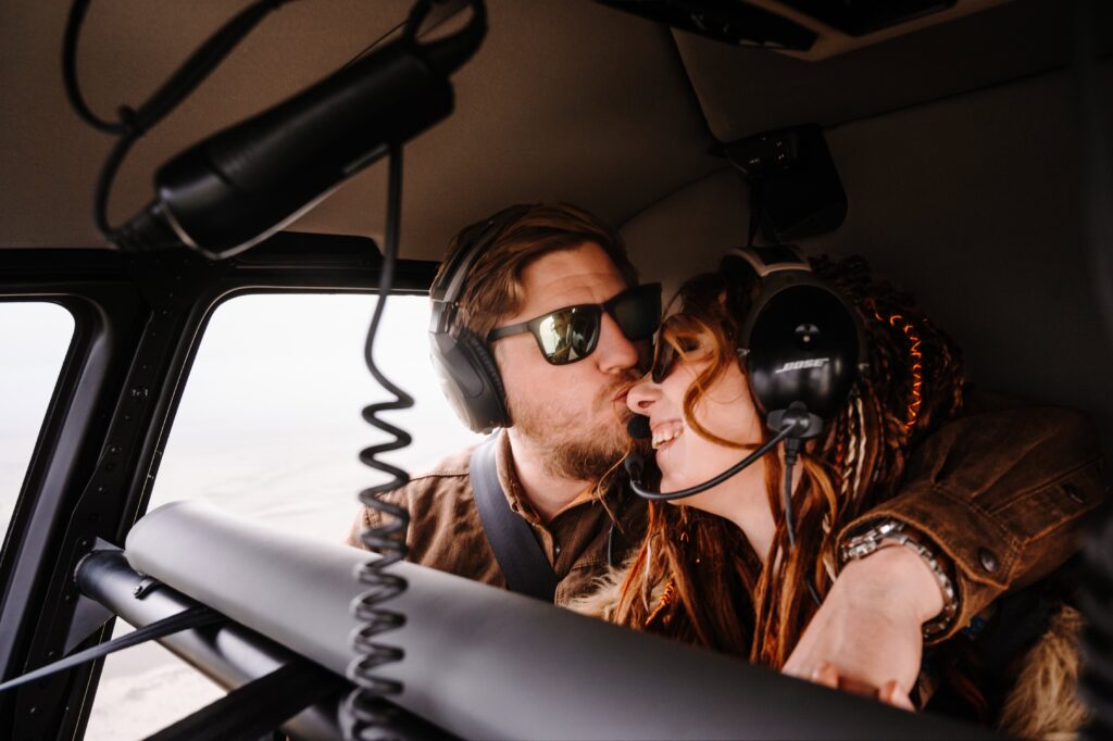 wedding couple transporting in a heli in Iceland for their ceremony in the mountains