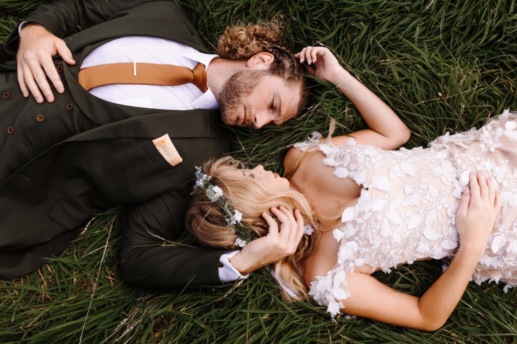 A couple lay side by side during their Northern Ireland elopement adventure. 
