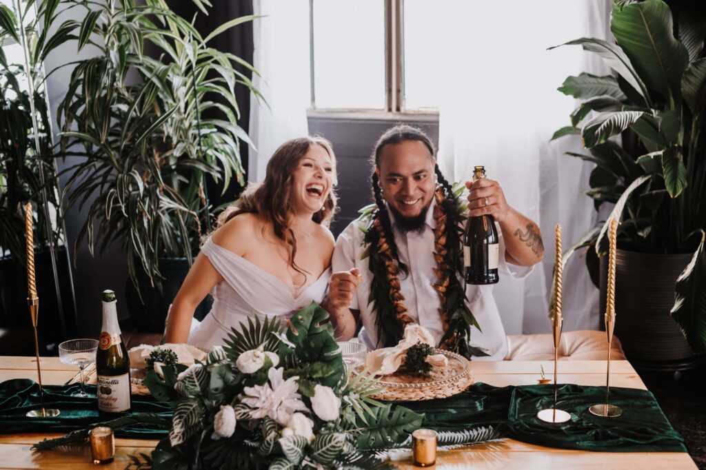 A joyful couple cheers to their new union!