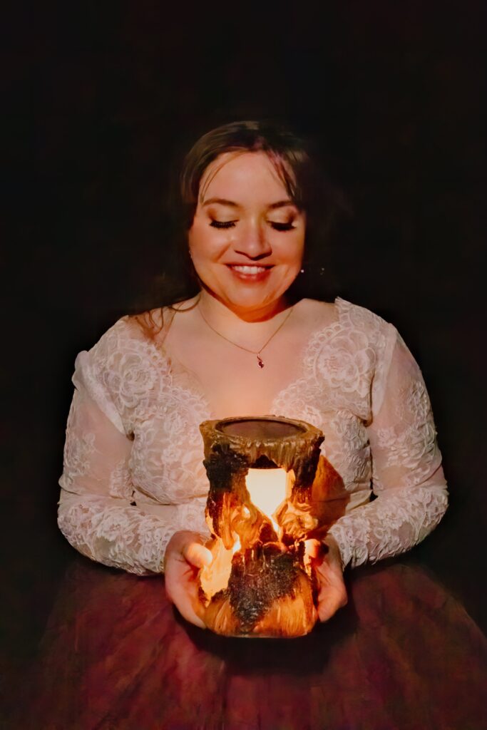 Bride with a paper lantern under a starry sky.