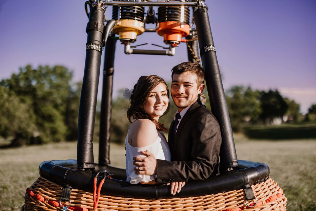 Bride and Groom in the their hot air balloon elopement basket, ready for takeoff!