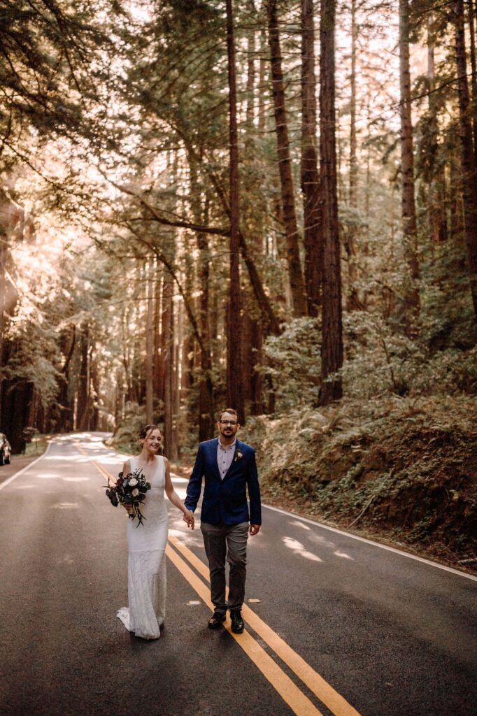 Newlyweds walking the back roads of Redwoods National Forest.