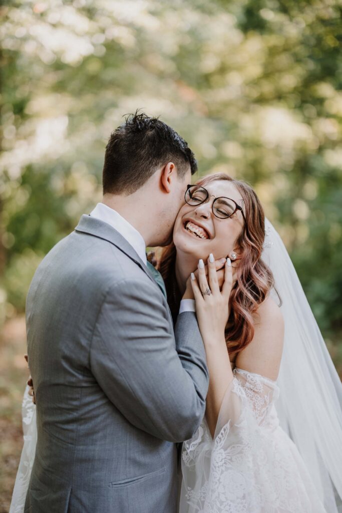 Newlyweds embracing in laughter.