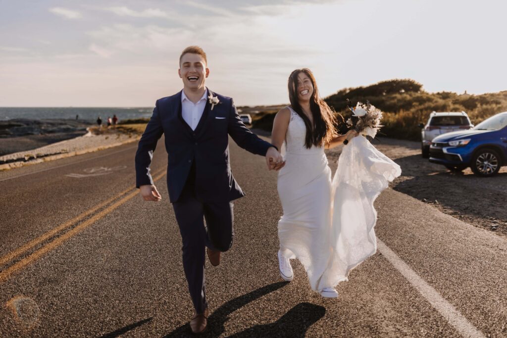 Newlywed couple exploring the Rhode Island coast.
