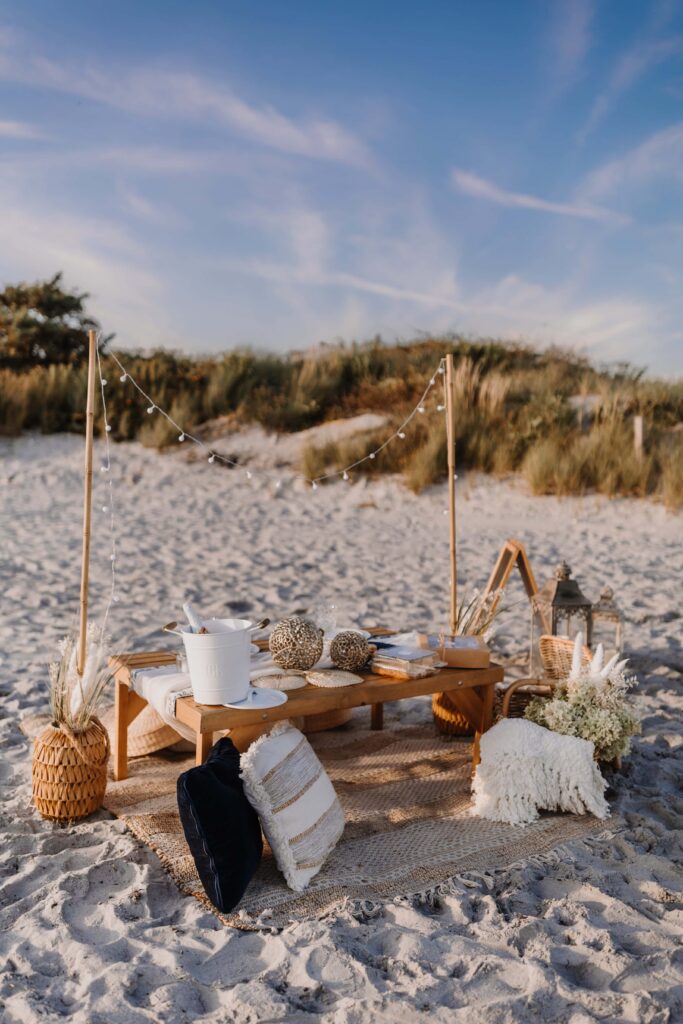 Newlywed couple enjoying their intimate elopement picnic on the the Rhode Island coast.