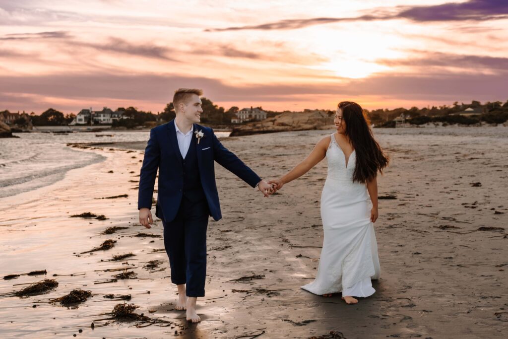 Newlywed couple exploring the Rhode Island coast.
