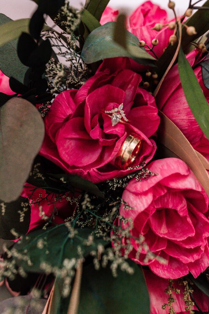 A close up of the bride's hot pink peony inspired Sola Wood Bouquet.