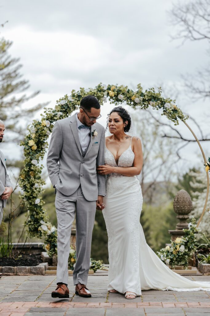 Pandemic Elopement under a perfect circle arch.