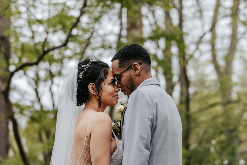 Pandemic Elopement Newlyweds embrace lovingly.
