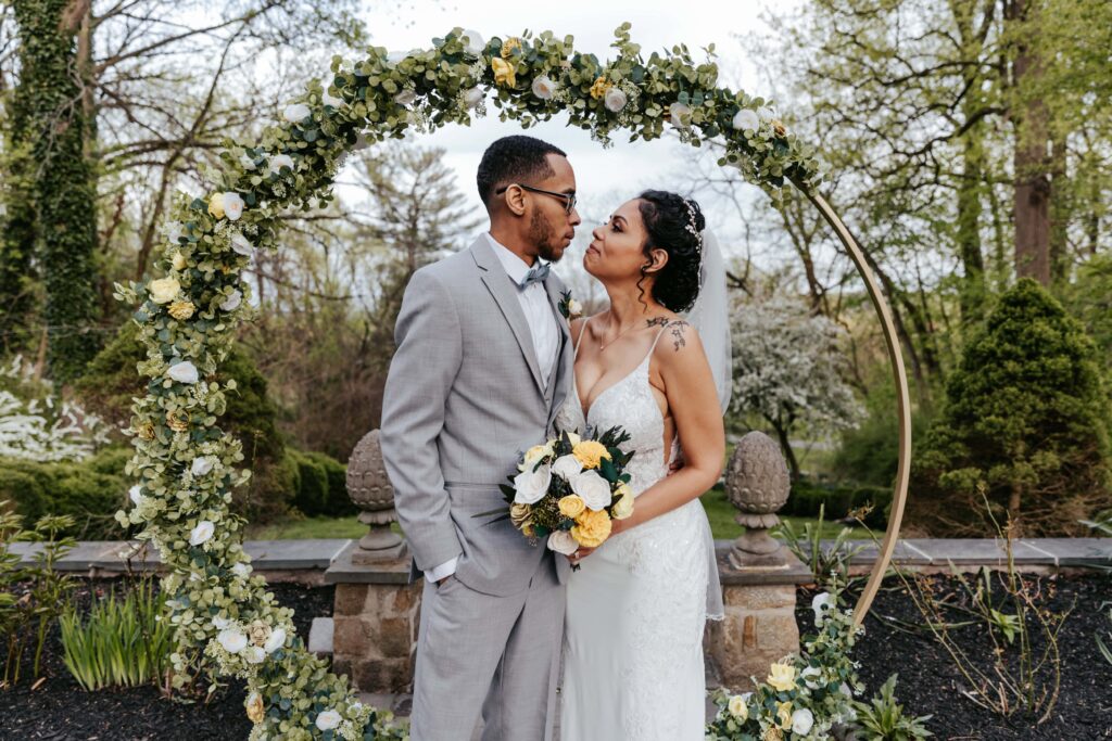 Newlyweds embrace lovingly.