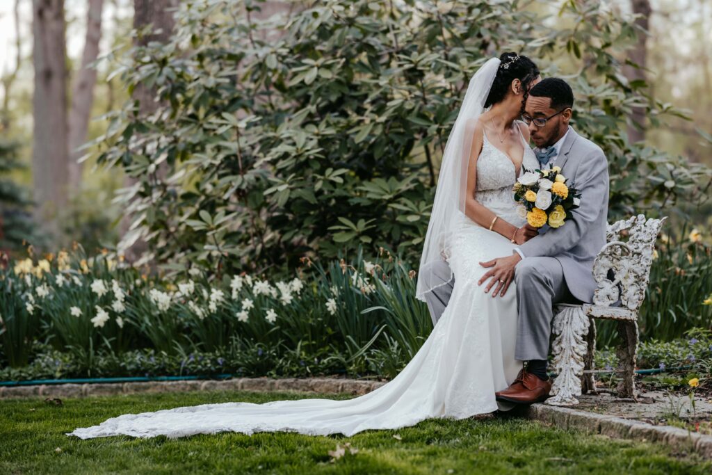 Newlyweds embrace lovingly.