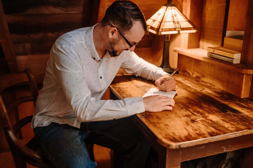 Groom writing his vows 