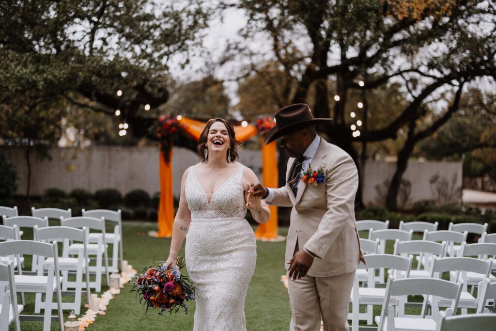 A couple laughs as they celebrate their elopement.