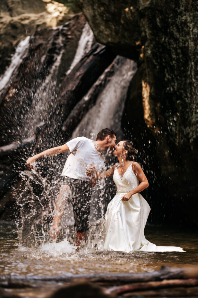 Newlyweds frolic in the water at Kilgore State Park.