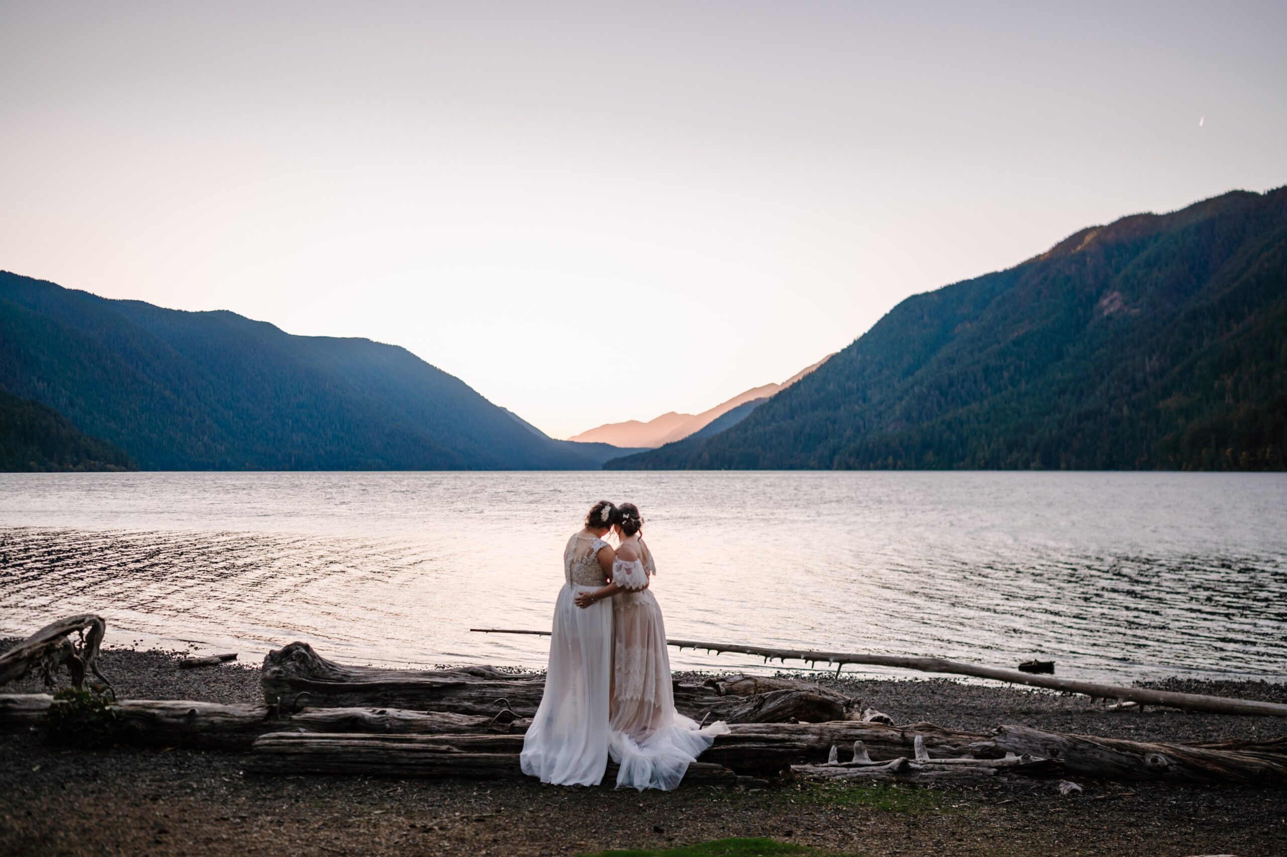 Brides embrace for a sweet post ceremony photograph on Hurricane Ridge in Washington.