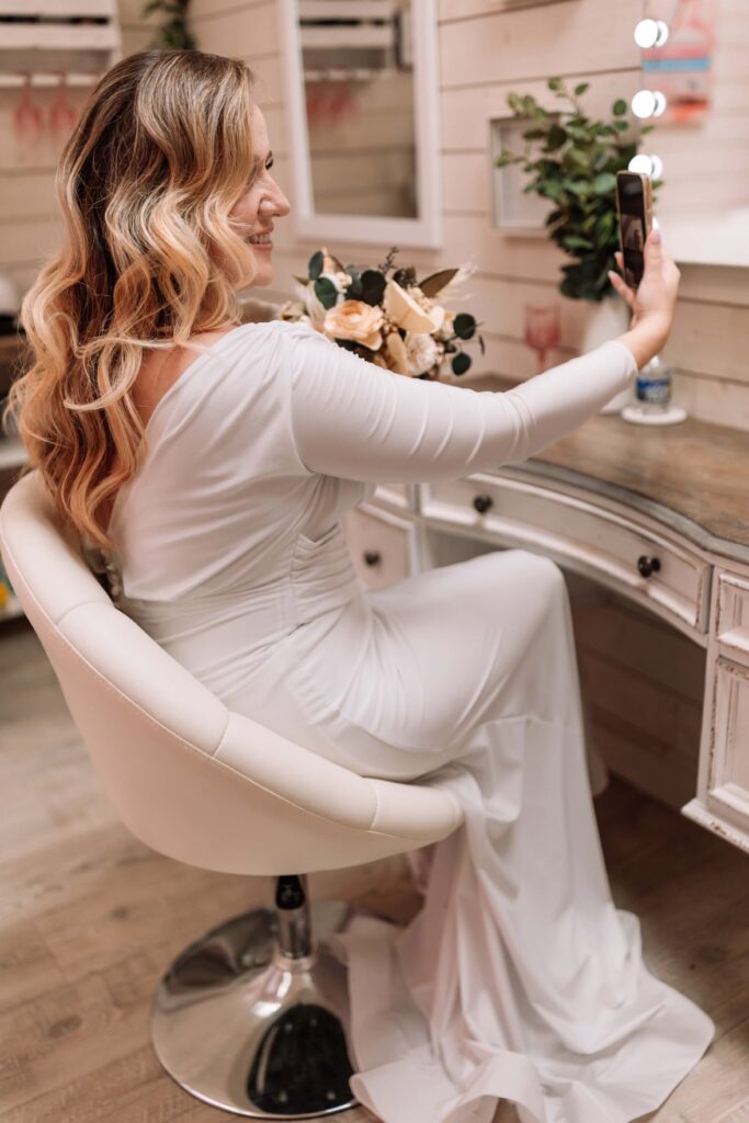 Lovely bride face-timing family before her ceremony.