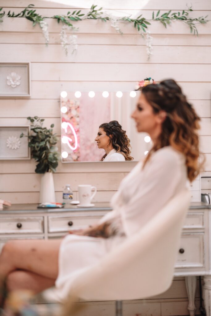 Joyful bride in our Bridal Suite She Shed getting ready for her ceremony.