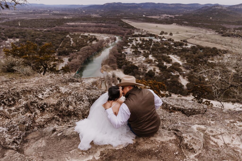 Garner-State-Park-TX-camping-Elopement-small wedding venue couple kissing on top of a mountain_www.ezelopements.com