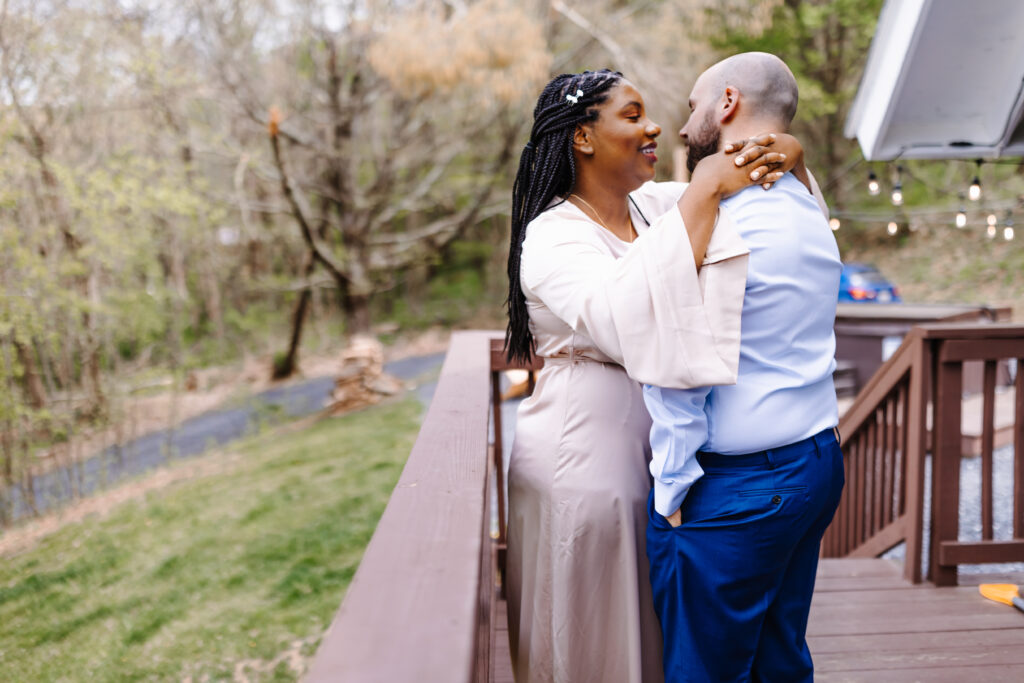 Couple share a special getting ready moment at their AirBnB.