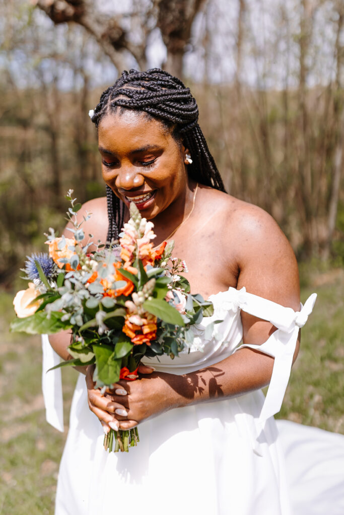 Beautiful Bride showing off Summer Wedding trend, bows with her simple tie sleeves. 