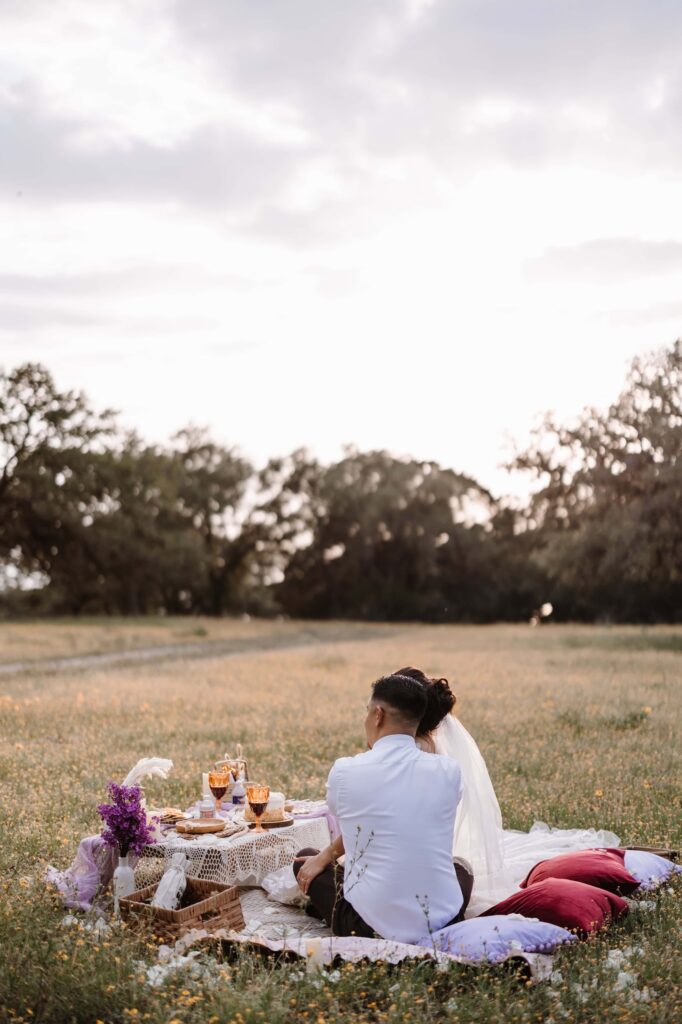 Canyon-Lake-Overlook-TX-Elopement Small Wedding Venue in Texas couple enjoying luxury picnic _www.ezelopements.com
