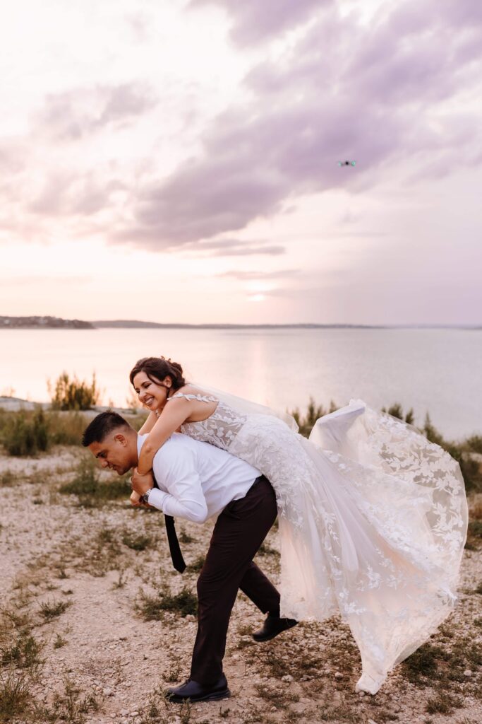Canyon-Lake-Overlook-TX-Elopement Small Wedding Venue in Texas bride and groom piggybag ride_www.ezelopements.com