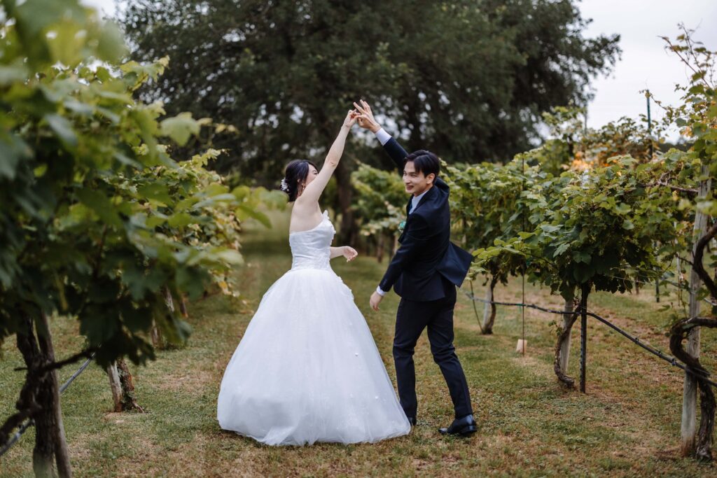 Oak-Valley-Vineyards- San Antonio Intimate Wedding Venue TX-Micro wedding Bride and Groom Dancing in the Vinyeard_www.ezelopements.com