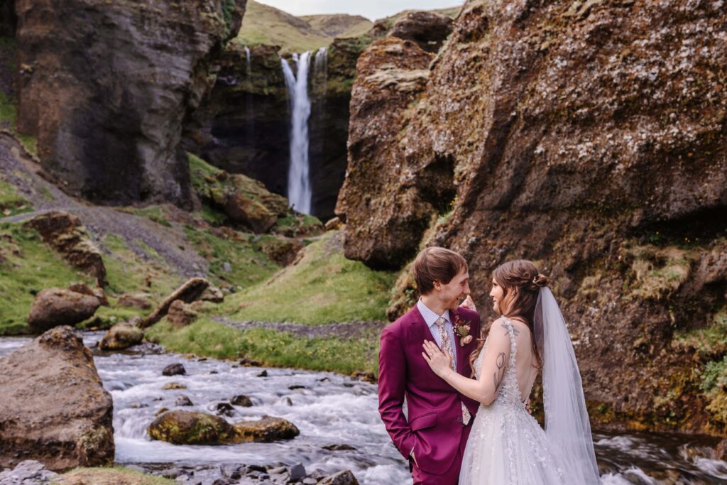 Bride and Groom embrace in front of a gorgeous vista. 