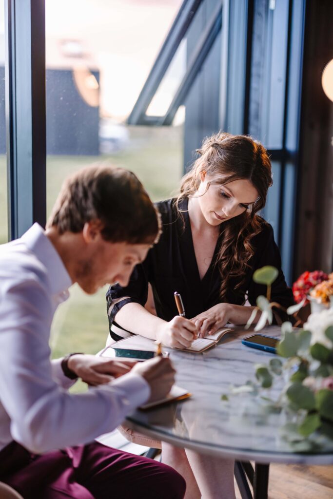 Bride and Groom writing each other letters to read during their ceremony.