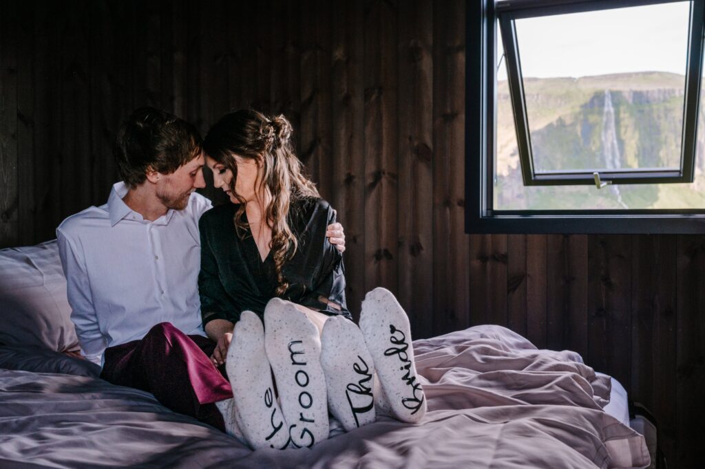 Bride and Groom getting ready in "Bride" and "Groom" socks.