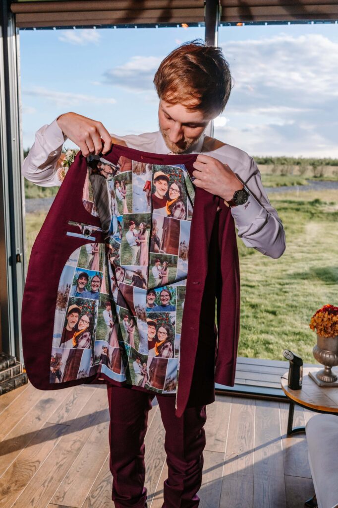 Groom showing off the custom photo lining on his suit.