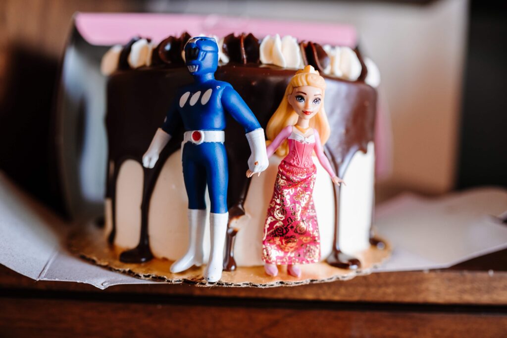 Custom action figure cake toppers for a quirky couple.