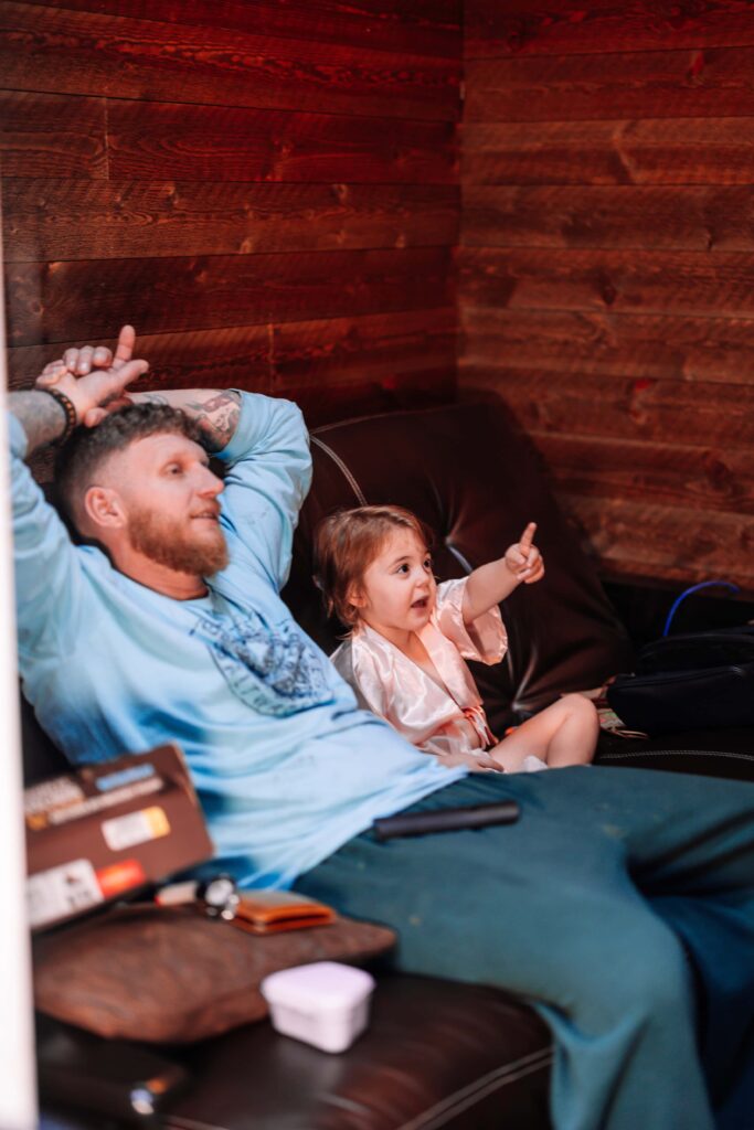 Dad and Daughter share some TV time before getting ready for the wedding.