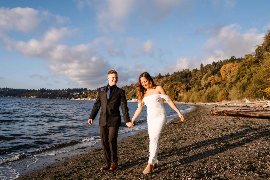 Newlyweds stroll the beach of a PNW state park during their Eco-friendly elopement.