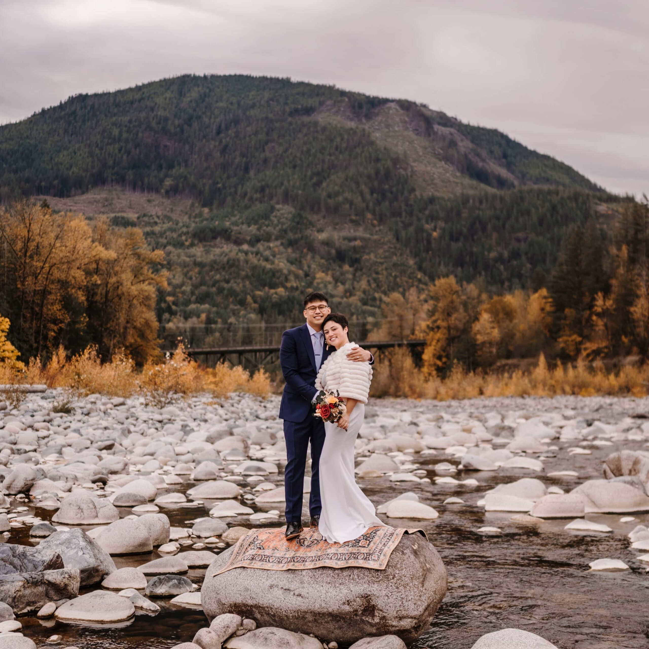 Couple say their vows amidst a flowing stream.