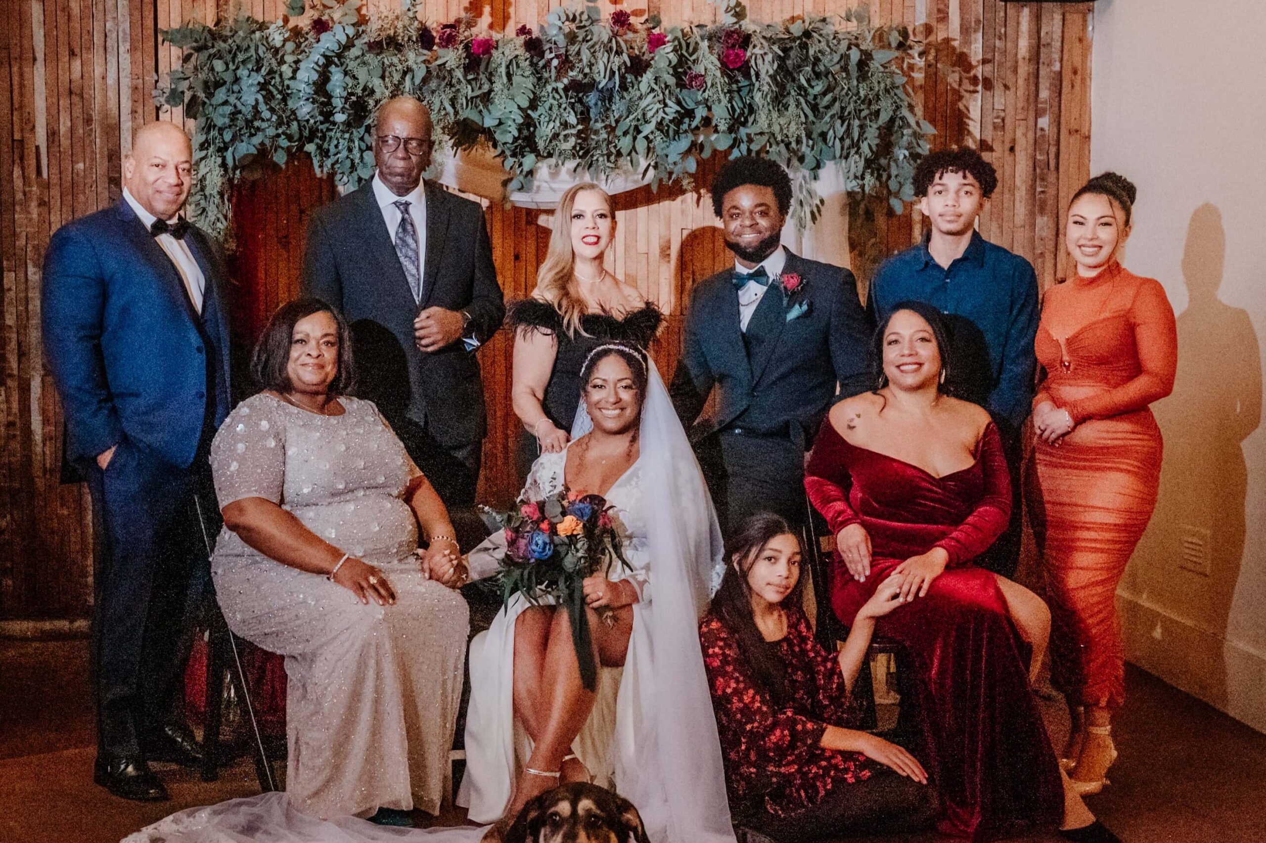 BRide, Group, and their wedding group pose for an intimate portrait.