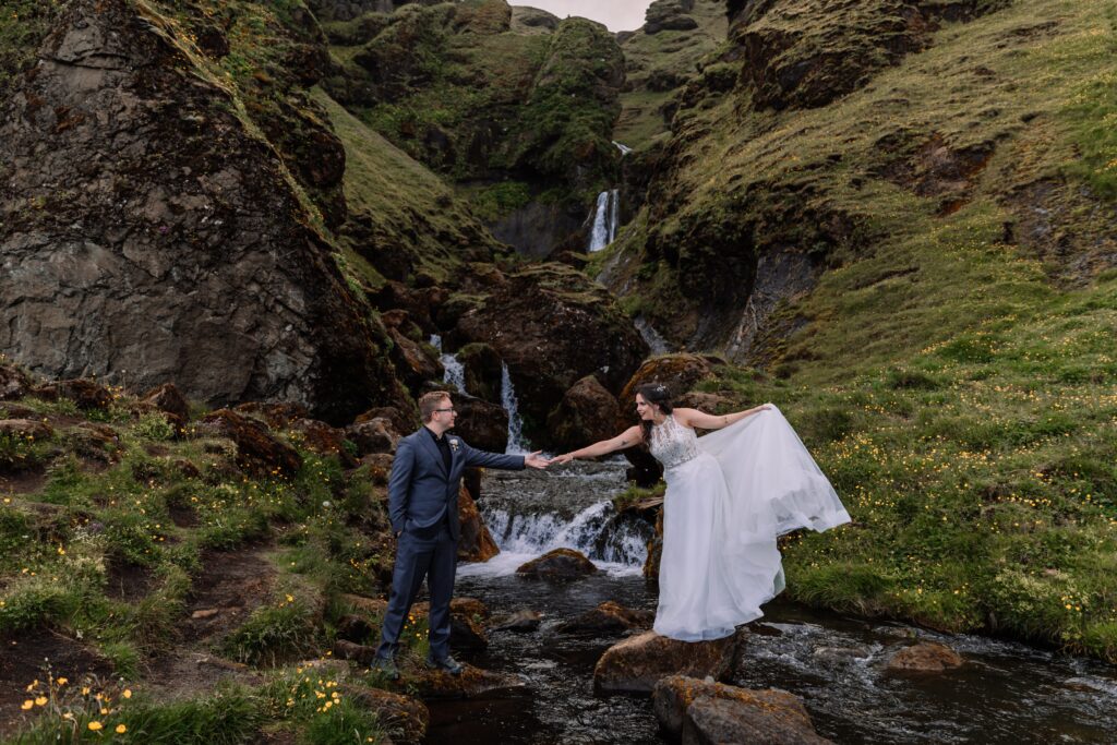 Newlyweds explore the coast of Iceland during their Icelandic adventure elopement. 