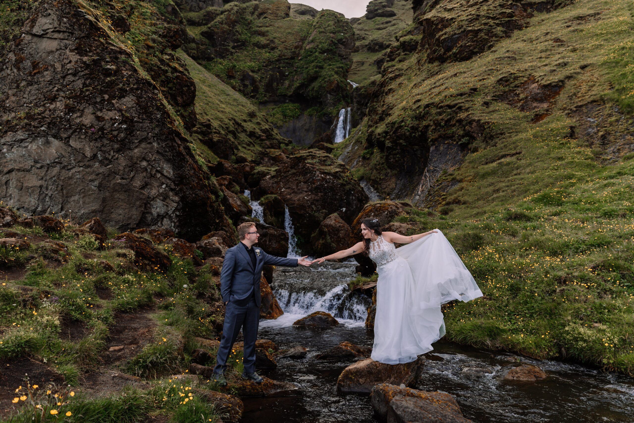 Newlyweds explore the coast of Iceland during their Icelandic adventure elopement.