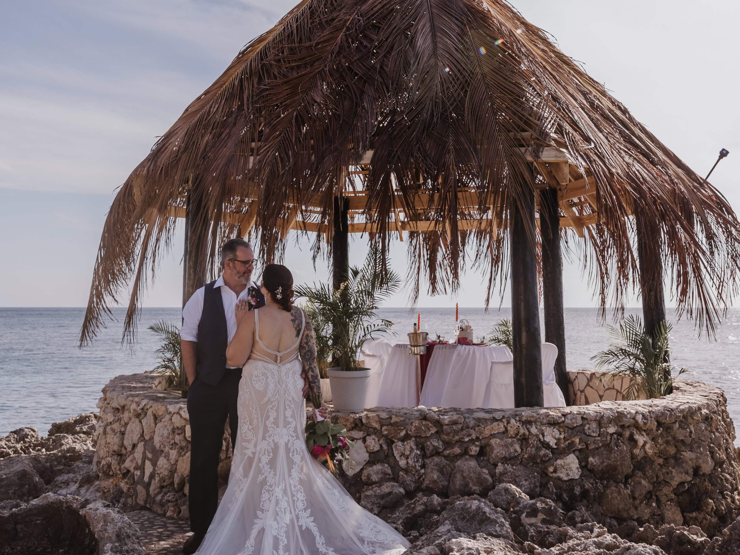 Bride and Groom in front of a beautiful Jamaican sky and a private elopement picnic.