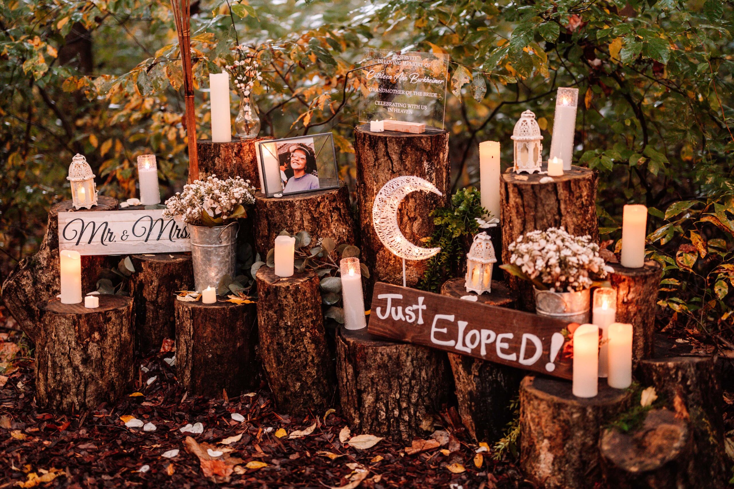 An array of meaningful framed photos and candles near the altar.