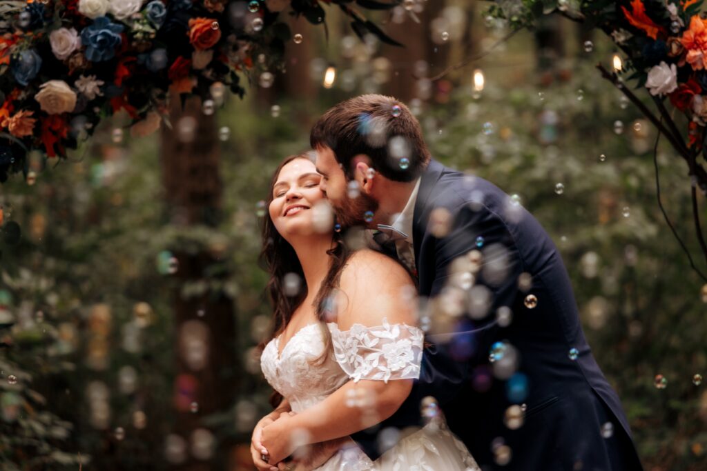 Lovely couple sharing an embrace during their golden hour photo session post ceremony. 