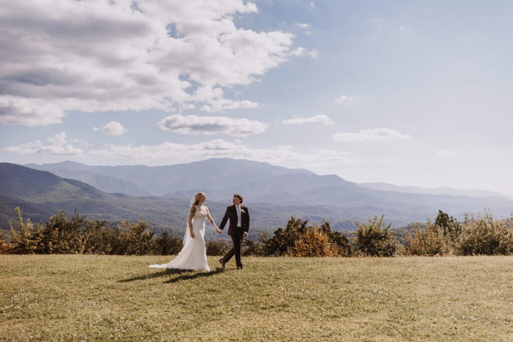 The Bride and Groom strolling beside the gorgeous Smoky Mountain Views.
