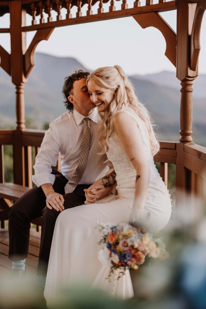 Newlyweds sharing a beautiful moment after their ceremony to exchange additional private vows.