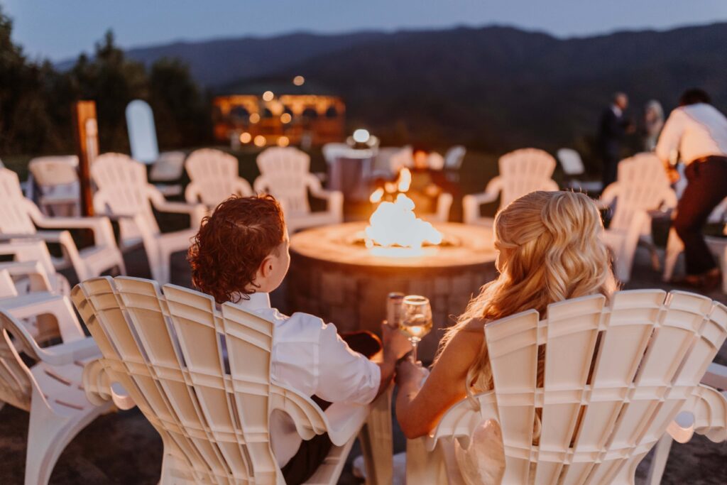 Newlyweds cozying up to the fire after their big day.
