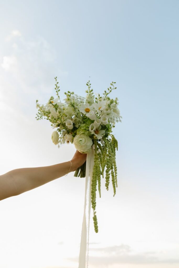 One of the top wedding trends in 2026 and 2027 is architectural, asymmetrical bouquets.